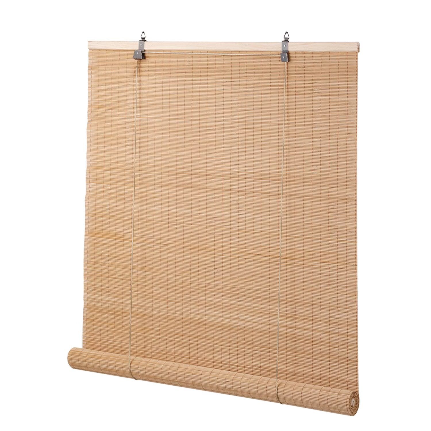 Roll-up bamboo window blinds in a cozy bedroom setting