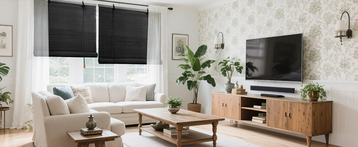 Dark charcoal bamboo roll-up shade centered over a window