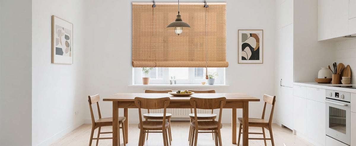 Medium brown bamboo roll-up window shade centered on window frame with cord pull.